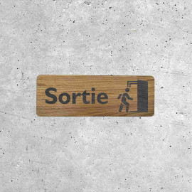 Panneau de sortie en bois avec pictogramme de porte